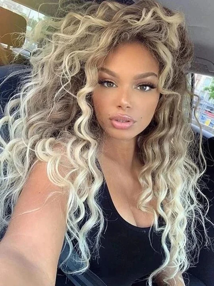 SuQ Synthetic Deep Wave Curly Wig Long Blonde Hair Wigs for Women Freepart Hairline Brown Roots Ombre Wig Natural Fluffy Wavy