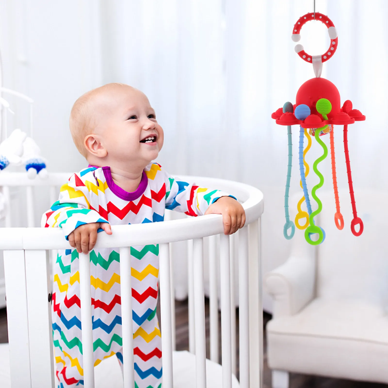 タコ型シリコン製プル紐おもちゃ。乳幼児の感覚学習、手と目の協調性、微細運動能力の発達を促します。