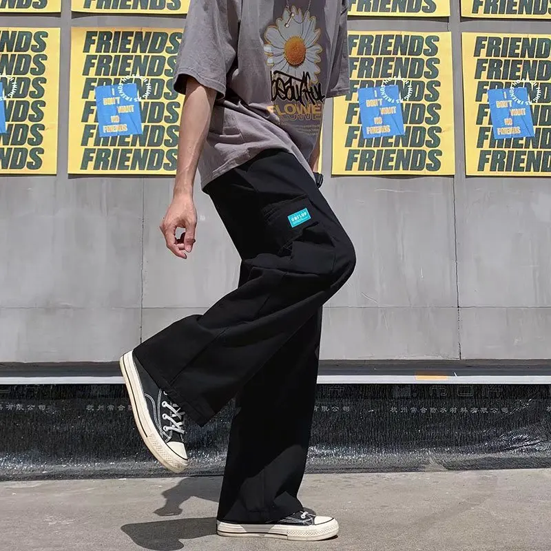 

Модные летние тонкие мужские спортивные штаны, свободные прямые спортивные повседневные брюки с манжетами, молодежные прямые брюки из полиэфирного волокна...