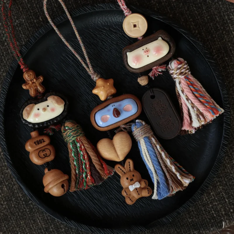 

Solid wood carved cute small animal bag charm with tassels, creative handmade phone strap bag charm, car decoration keychain