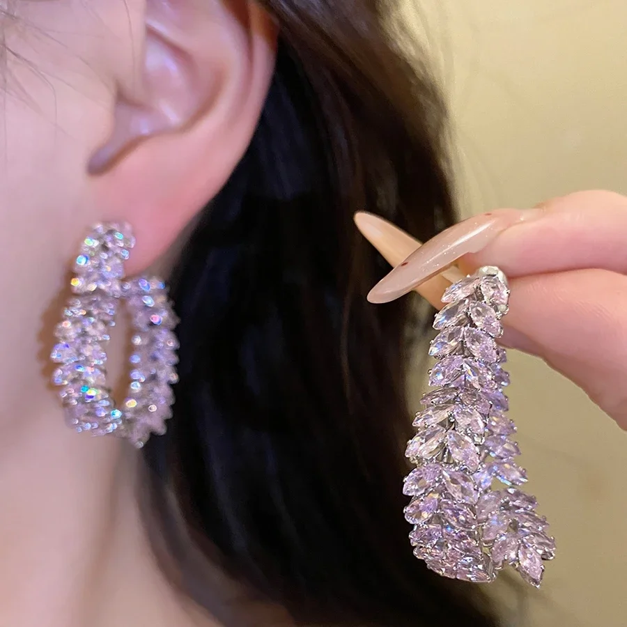 Silver color oval hoop earrings fully encrusted with light purple faceted stones for women elegant party accessories