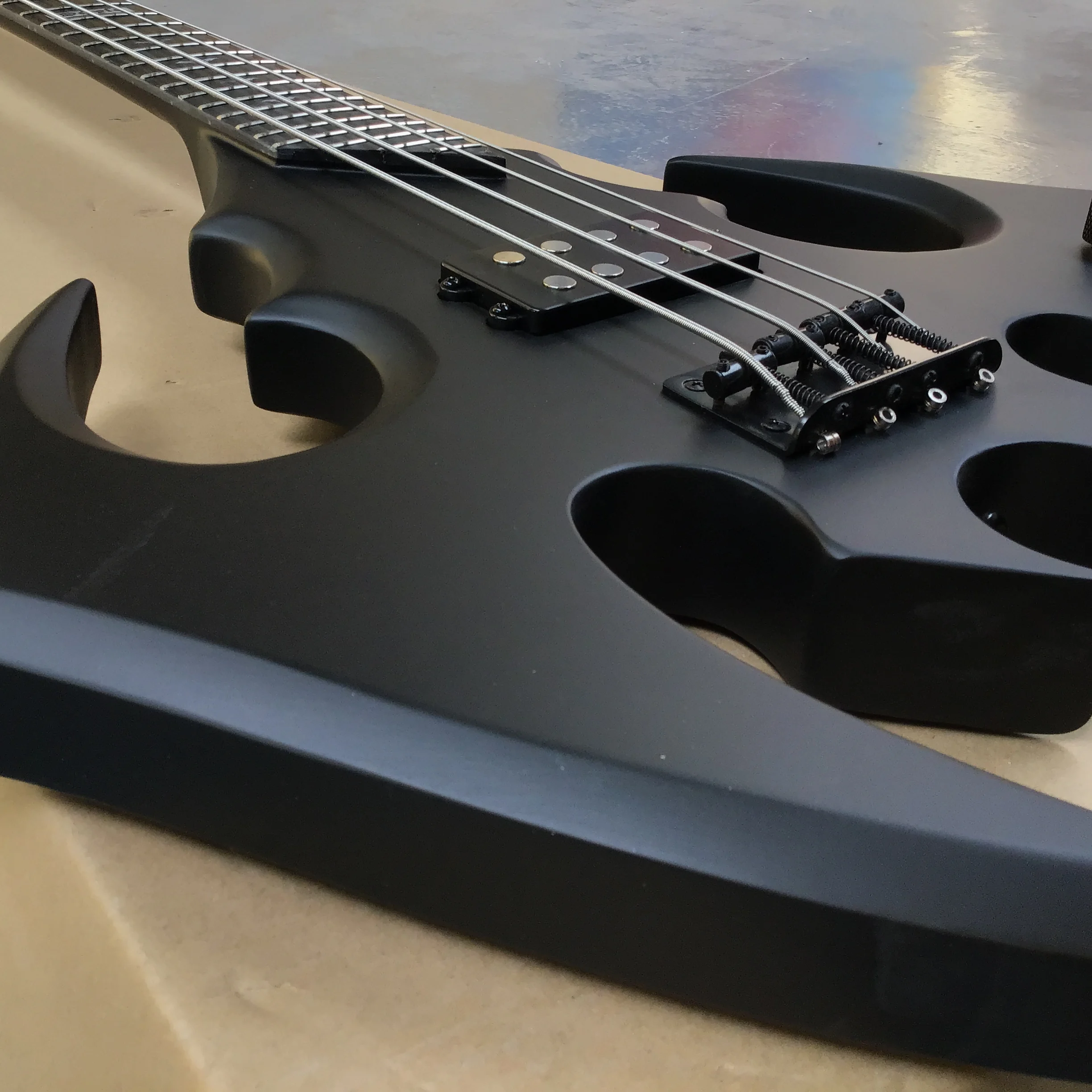 hot sales irregularity Bat shape 4-string electric  bass guitar, perfect tone black hardware hot sale in stock customizable