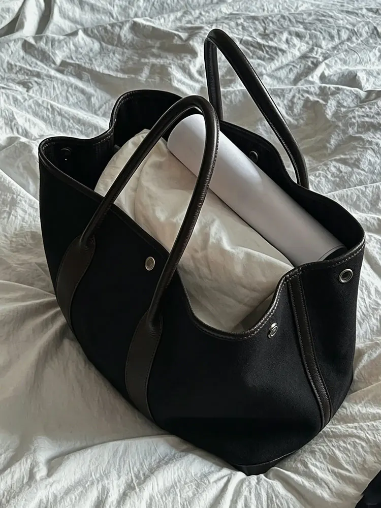 

Black Canvas Large Capacity Tote Garden Ladies Bag 2026 New High-End Commuter Handbag Single Shoulder Soft PU Leather