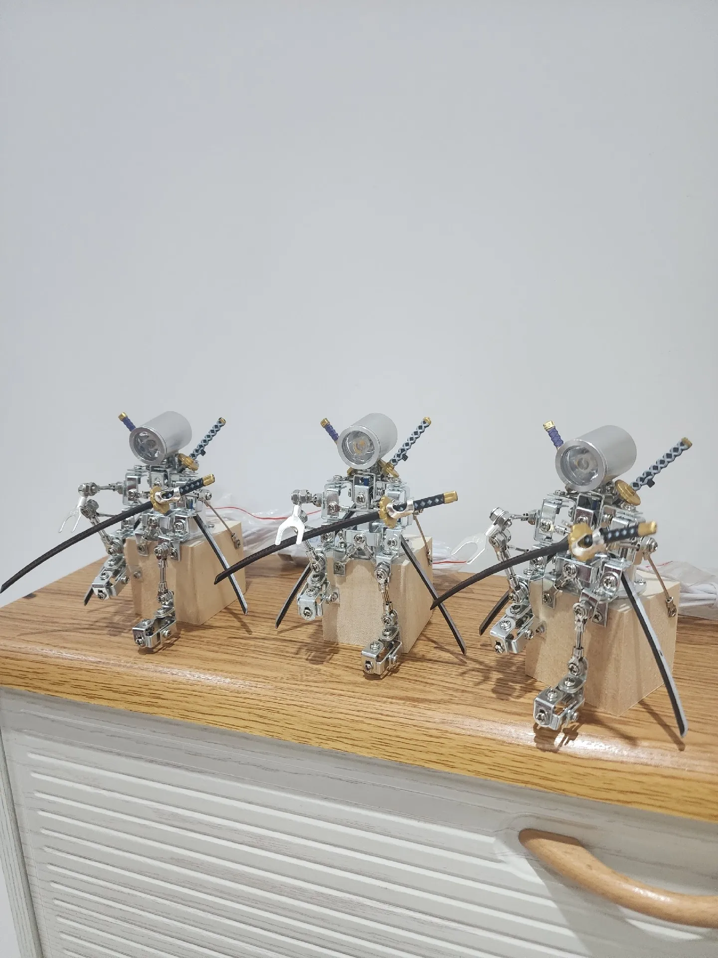 

A brand-new metal robot-themed bedside lamp with three knives!