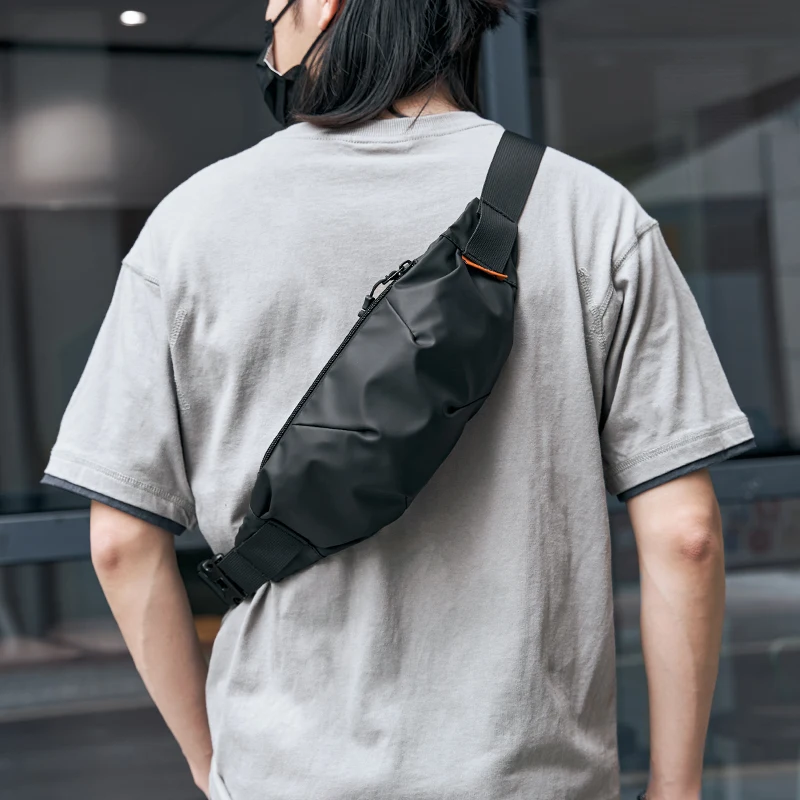 Bolsa de pecho para hombre negra impermeable bolsa multifunción de viaje corto de moda ligera con cremallera antirobo para teléfono al aire libre