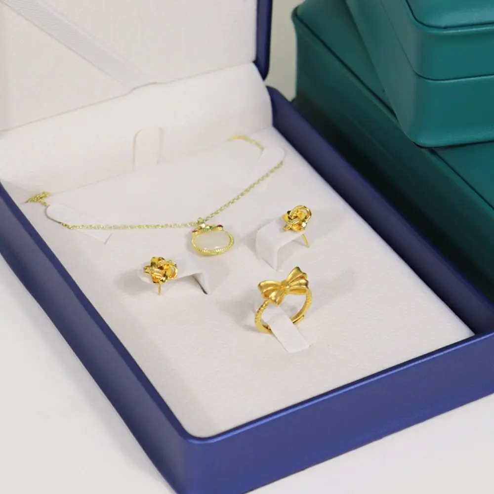 الحد الأدنى بو الجلود والمجوهرات صندوق تخزين تاج حافة مستديرة قلادة قلادة المنظم أقراط حلقة عرض القضية للنساء