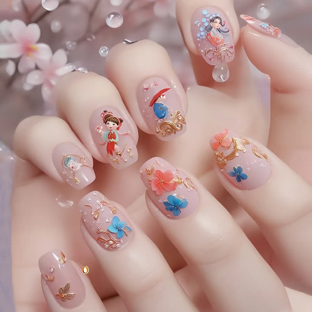 24개 유니크 플로잉 플로럴 프레스온 네일, 골드 악센트, 블루 핑크 꽃 & 만화 캐릭터, 미디엄 코핀 쉐입