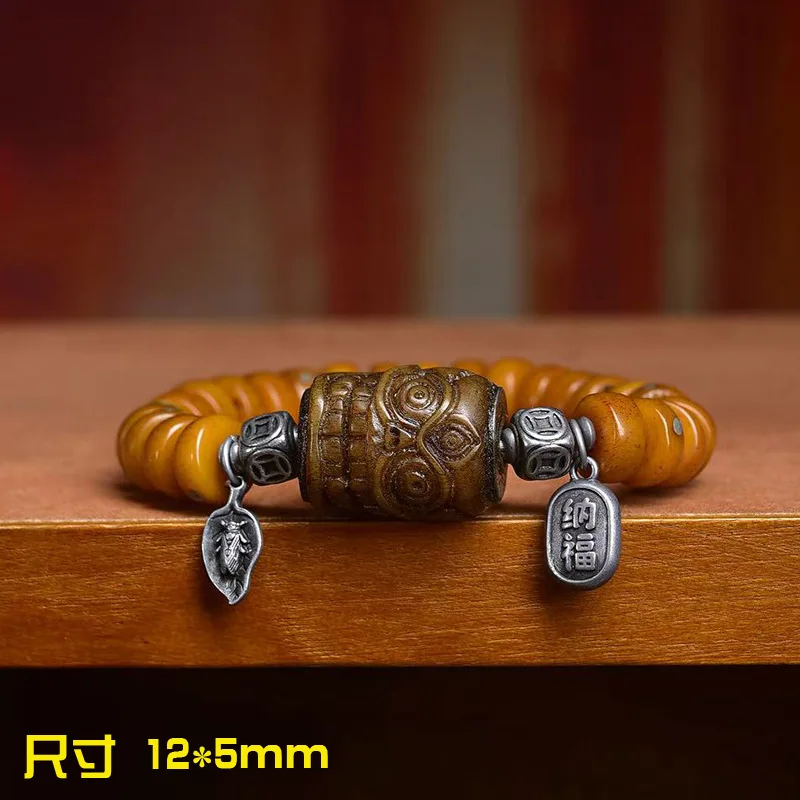 Pelvic bracelet with carved copper inlay and camel bone accent bead   a collectible Buddhist bead