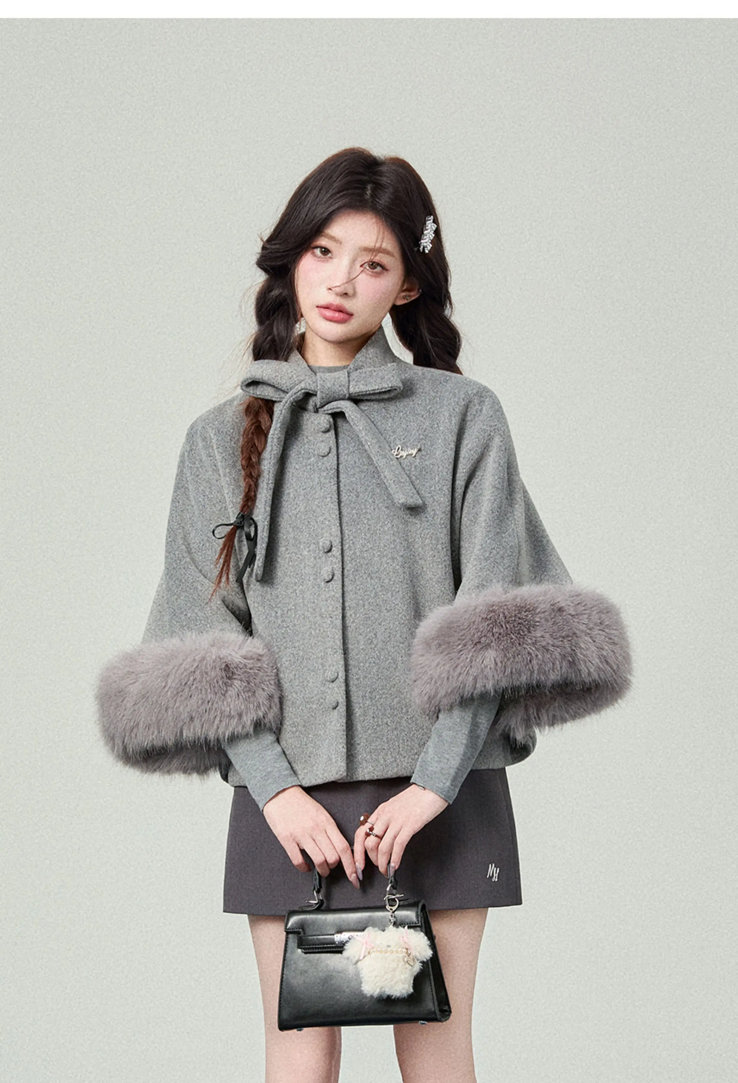 2025 Otoño Invierno nuevo estilo universitario de gama alta de las mujeres peludas blanco Floral gris negro suelto con cordones capa abrigo