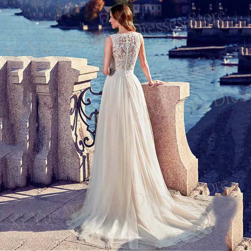 Boho Romantic A-Line Wedding Dresses O-Neck Sleeveless Fascinating Lace Appliques Bride Gowns Tulle Illusion Button Robe Mariée