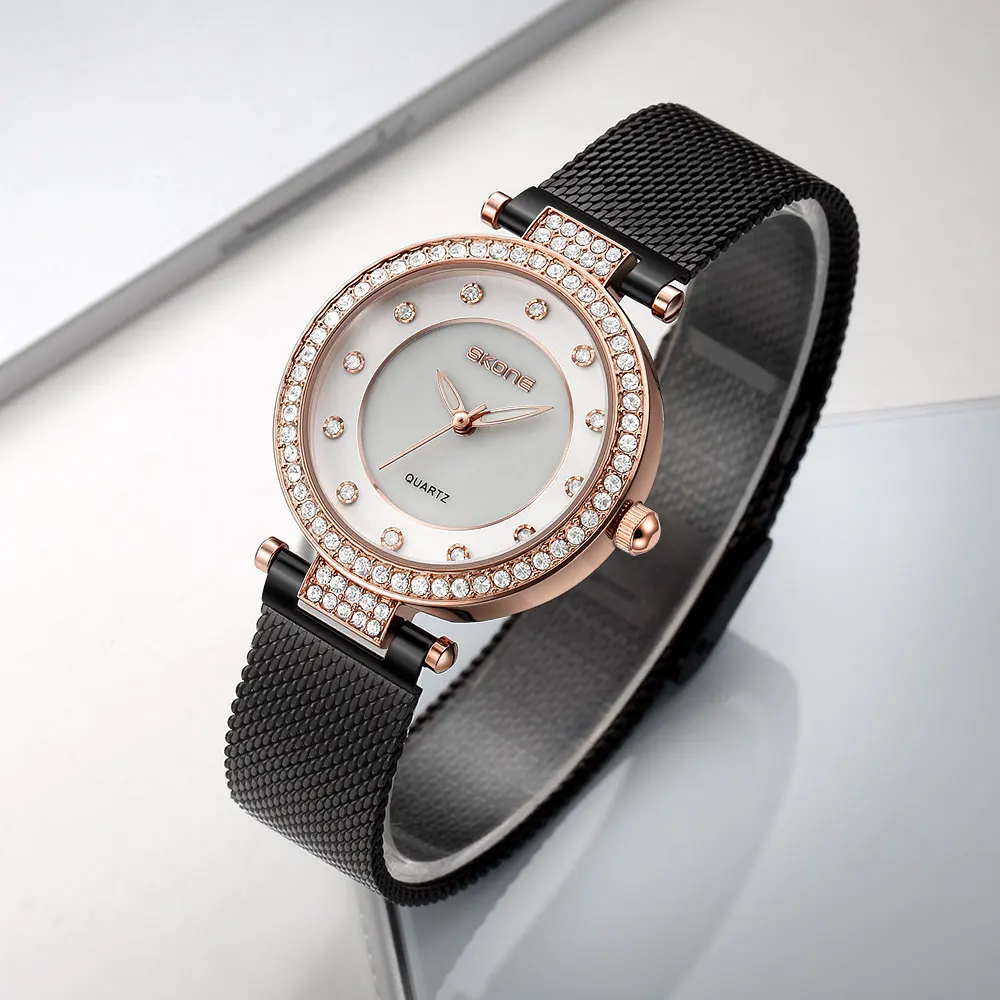 SKONE Diamond light lujo moda simple reloj de mujer correa de malla versión coreana casual temperamento reloj de cuarzo
