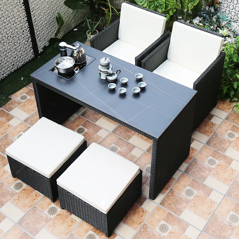 

Outdoor courtyard rock slab boiling water table chair combination open-air modern creative waterproof sunscreen rattan chair