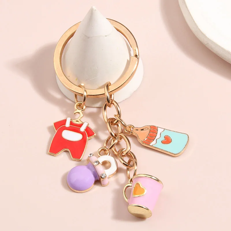 Cute cartoon girl DIY drip oil keychain suspenders clothes baby bottle baby pacifier couple cup key chain