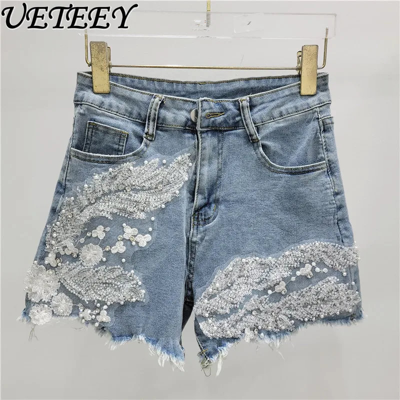 

European Goods Summer New Elastic Flower Embroidery Lace Stitching Tassel Raw Edge Denim Shorts A- line Wide-Leg Hot Pants