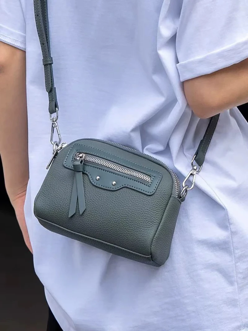 New style top-grain cowhide shoulder/crossbody bag with double zipper for casual mobile phones.