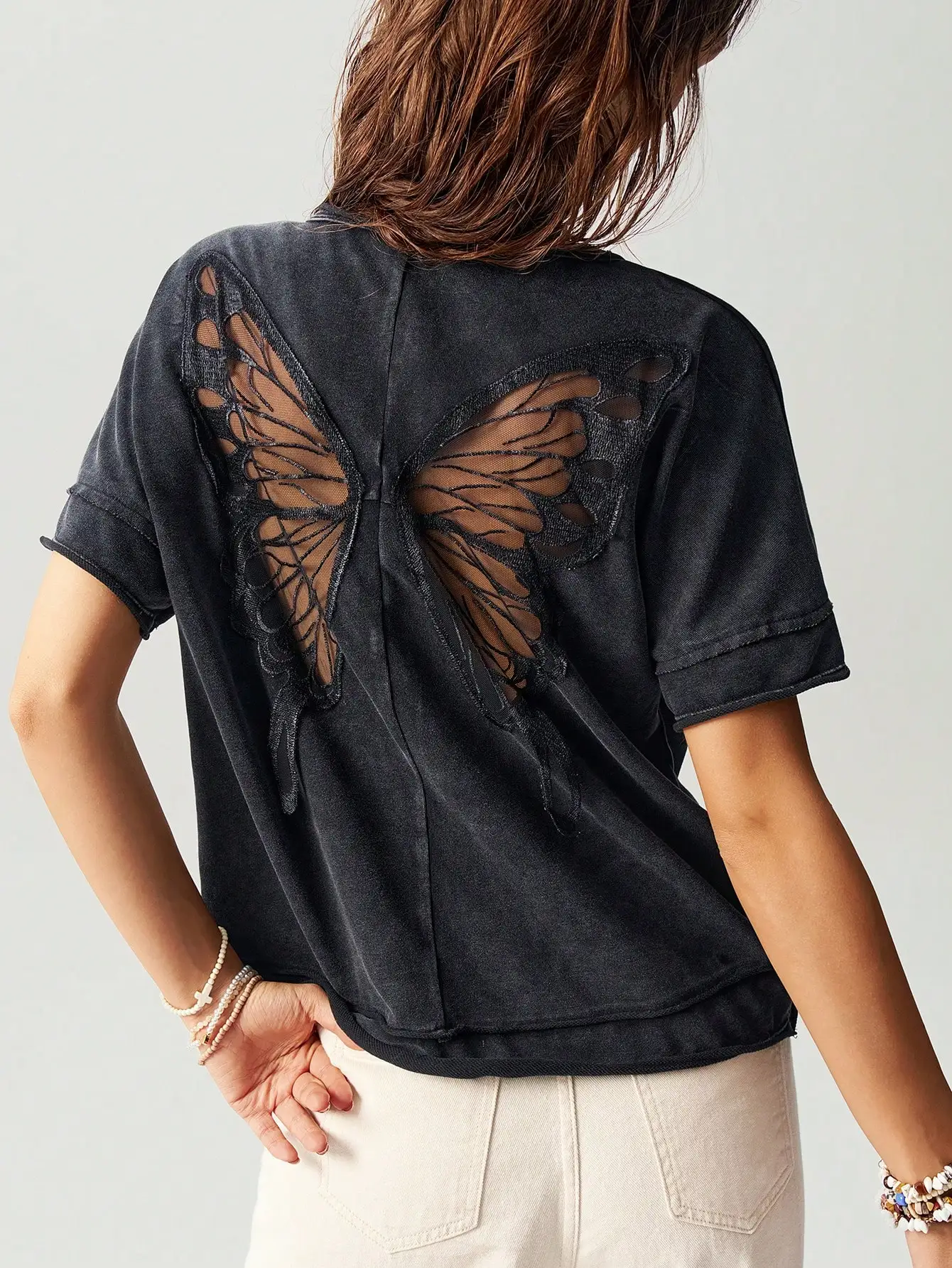 

Black Loose Knit T-Shirt with Sheer Butterfly Cutout Back Design