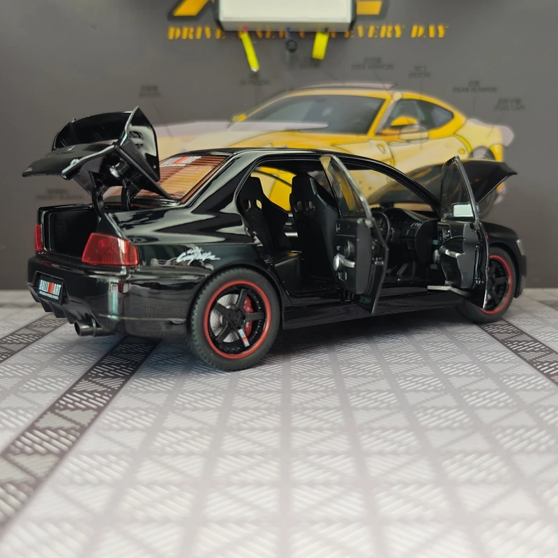 Modelo de aleación de coche de rally Mitsubishi EVO de 9ª generación a escala 1:24, puertas y capó del motor se pueden abrir.