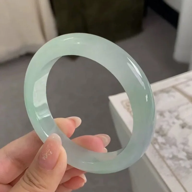 Myanmar Jadeite Sweet Jade Bangle, featuring a patterned design with bright green hues, an ice-like texture, and a tra