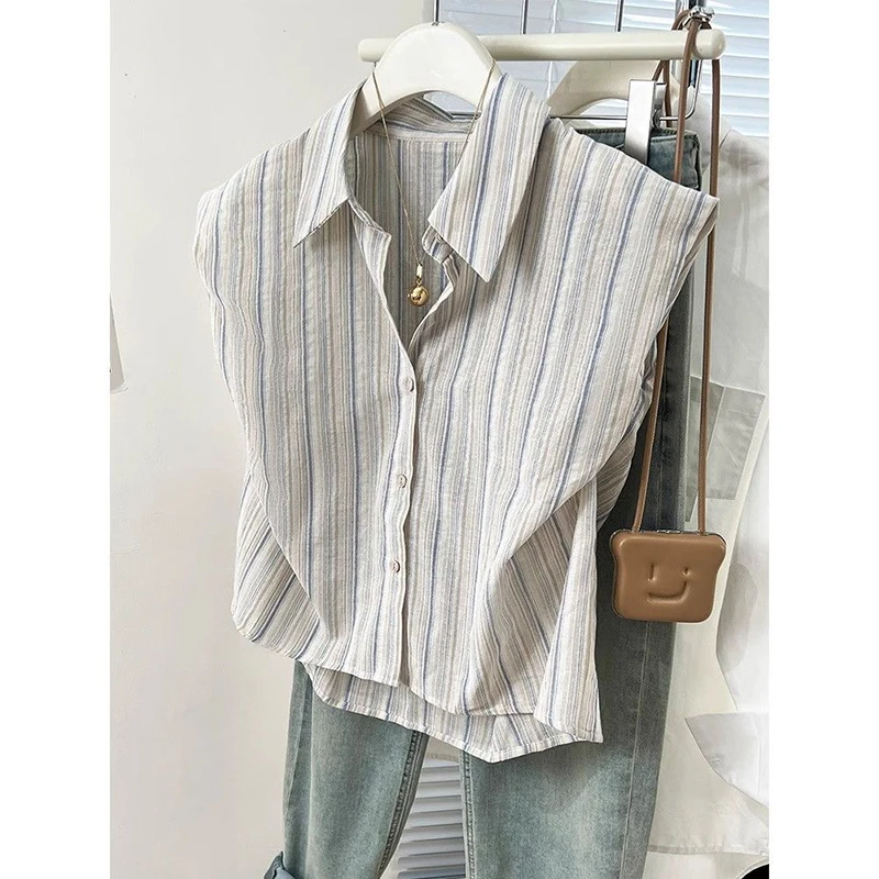 Camicia a righe asimmetrica allentata con bottoni alla moda Abbigliamento femminile 2025 Estate Nuove magliette casual Camicetta da donna senza maniche da ufficio