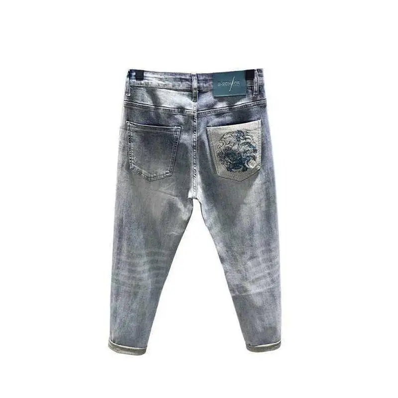 Luxury Man Clothing Brand Design Ripped Light Blue Jeans Men's Trendy Brand Pants Slim-fit Small Foot Patch Handsome Pants