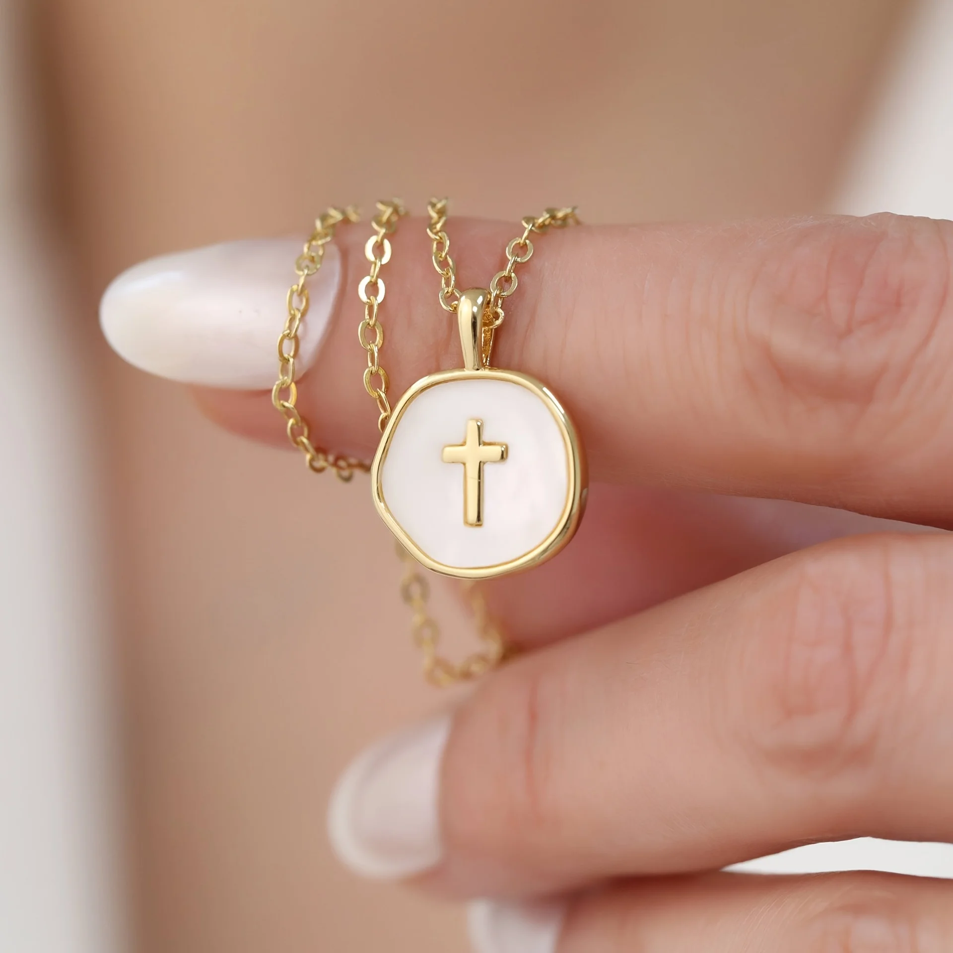 Elegant cross pendant with irregularly shaped enamel decoration, perfect for daily wear and gift giving occasions