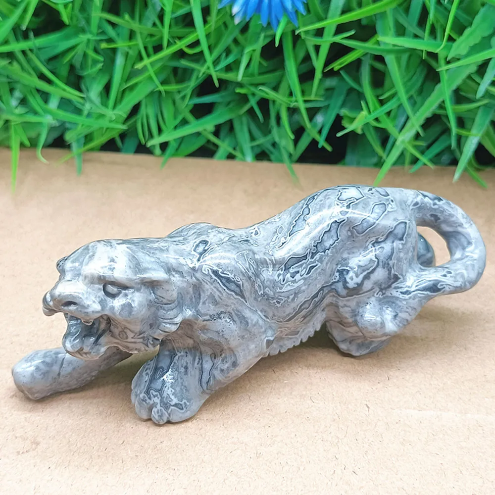 Natural quartz crystal carved into a tiger. Home decoration item. Ornament. Gift for others.
