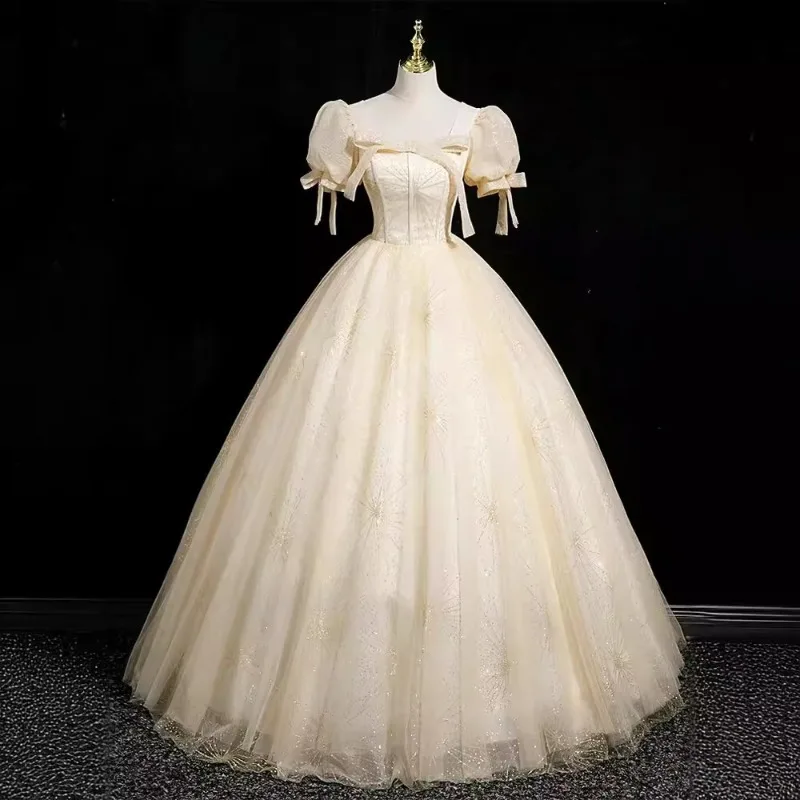 

2026 Women's New Champagne Square Neck Evening Dress Fashionable Slimming and Artistic Study Puffy Skirt Long Back Strap Dress