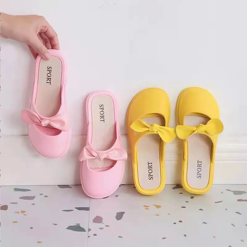 Children\'s New Summer PVC Little Girl Fashion Outside Wearing Solid Color Bow Half Drag Flat Sandals