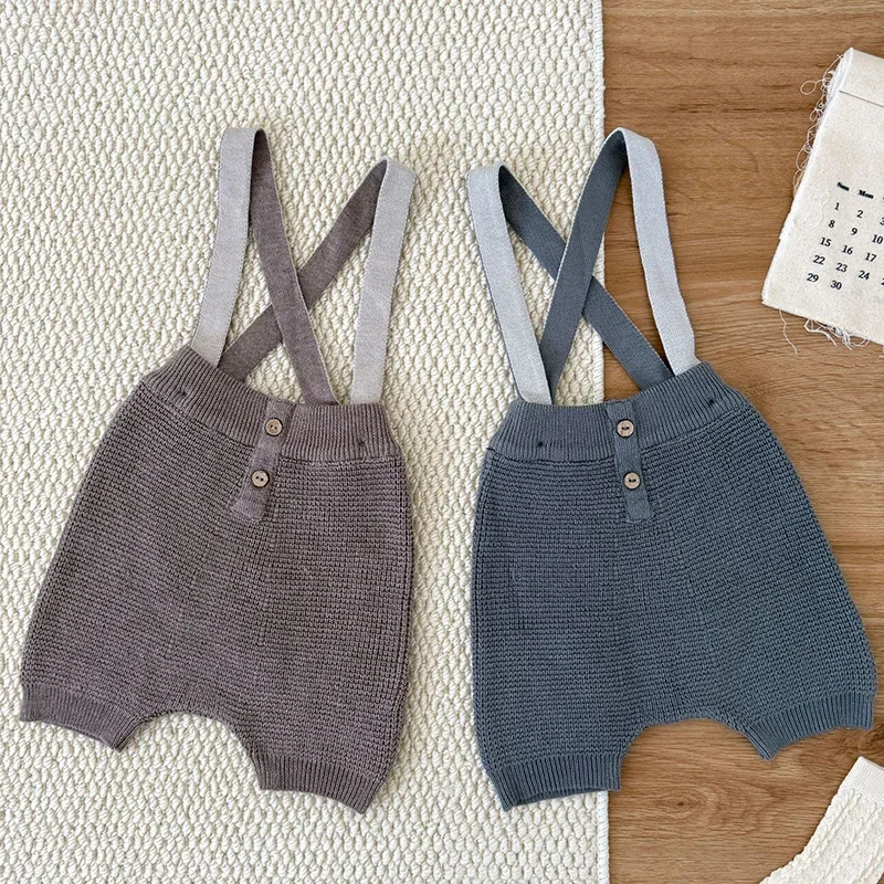 جديد ربيع 2026 بدلة قفز محبوكة للأطفال حديثي الولادة من الأولاد والبنات بدون أكمام بلون سادة ملابس أطفال على الطراز الكوري 0-24 متر