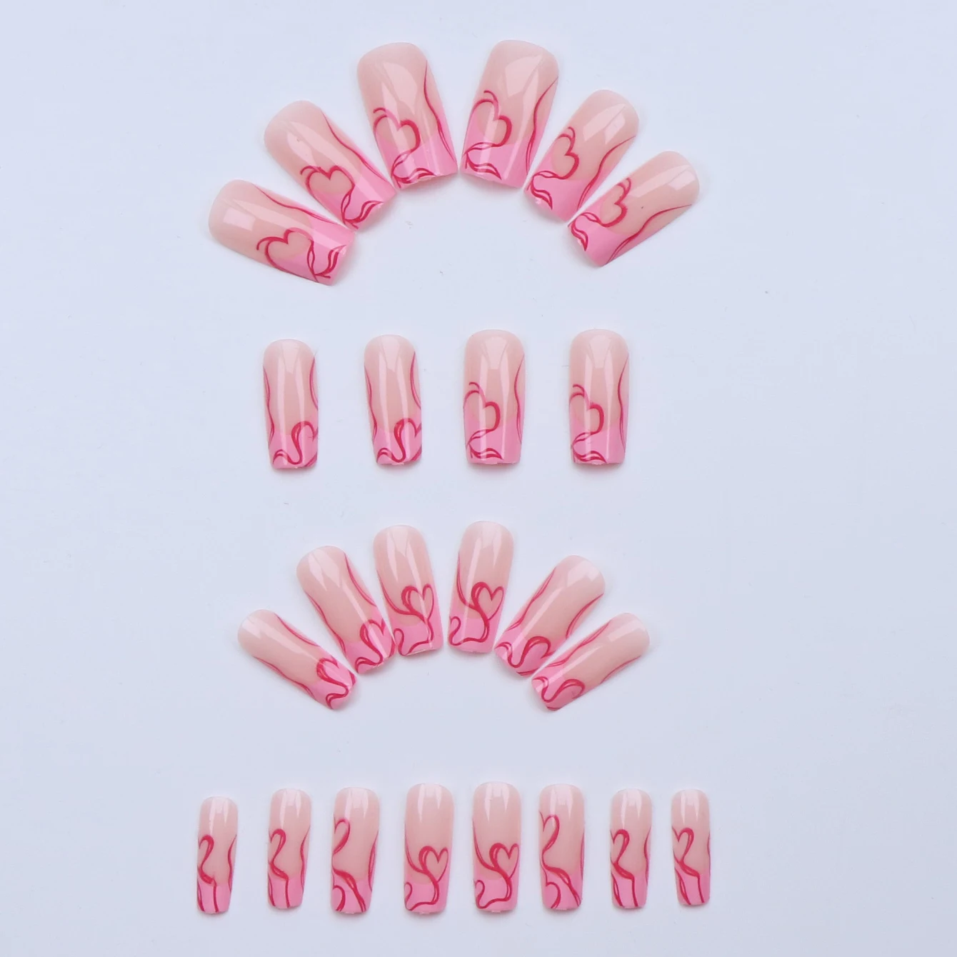 เล็บปลอมสีชมพูแบบฝรั่งเศส 24 ชิ้น ลายเส้นสีแดงกุหลาบ ลายหัวใจ ใช้ซ้ำได้ พร้อมกาวเจล 1 ชิ้น และที่ดันหนังกำพร้า เหมาะสำหรับผู้หญิง