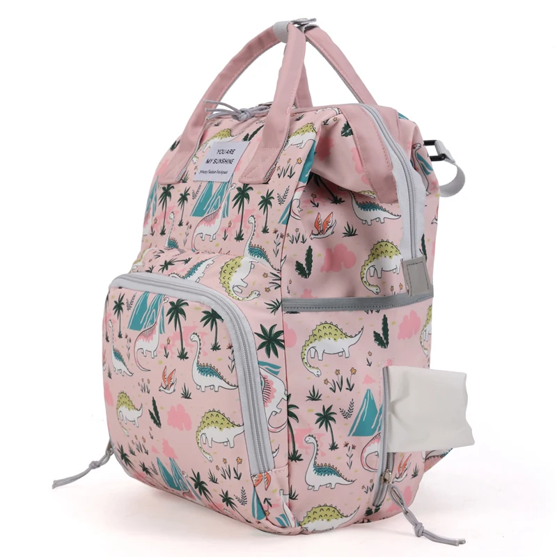 A lady hand-held mini mummy bag, cute dinosaur print backpack, suitable for daily use with a baby