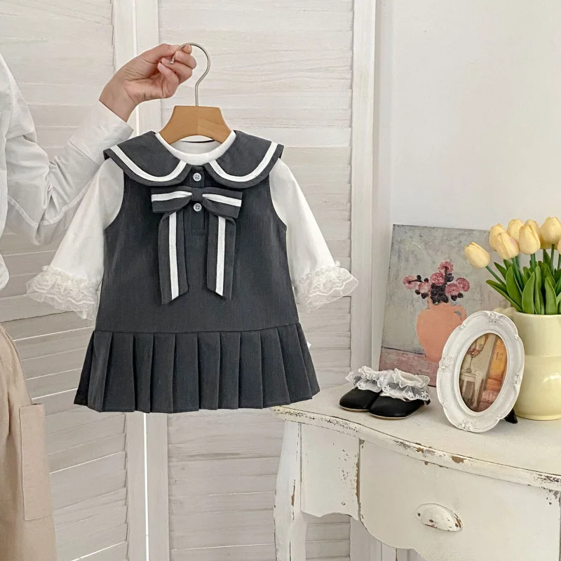 

2026Spring style two-piece set for baby girls, versatile base shirt, girls' college-style bowknot vest dress set
