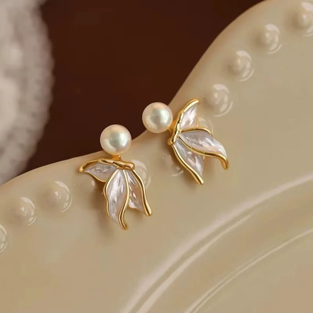 Uini Tail hot selling 925 pure silver needle sweet pearl fish tail earrings niche 2026 new light luxury high-end women's earring
