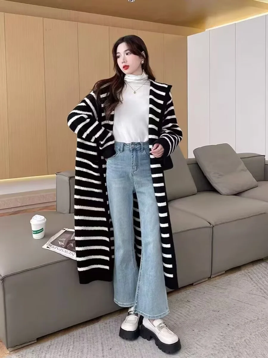 

Корейский стиль: Новая женская вязаная куртка с капюшоном в полоску, осенне-зимняя, средней длины, с эффектом высокого качества и индивидуальным дизайном