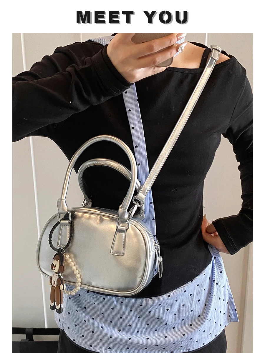 

Light luxury simple designer 2025 summer new trendy fashion high-end niche one-shoulder messenger bag portable bowling bag trend