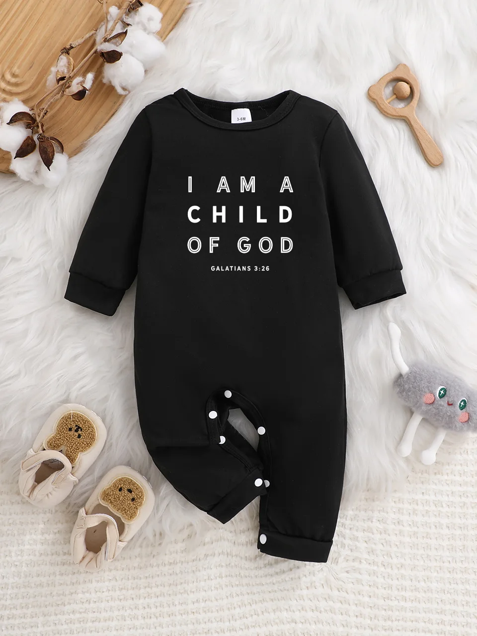 Baby long-sleeved bodysuit with fun letter prints, button design, easy care, suitable for new parents.