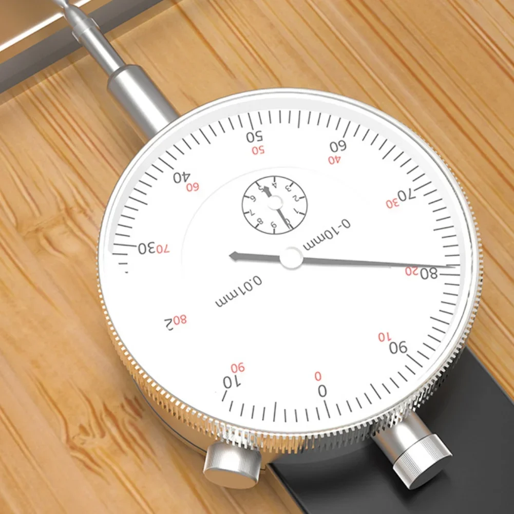 

Adjustable dial indicator for saw table blade parallelism correction and accurate workshop machine measurement