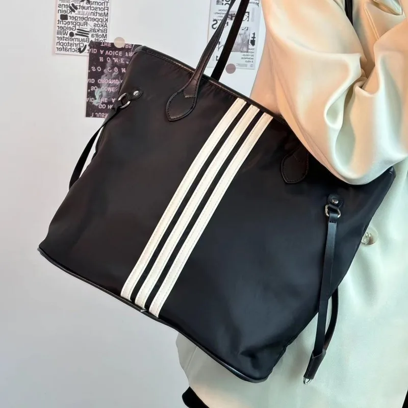 

2025 large capacity student commuting bag for class, women's new nylon canvas bag, fashionable one shoulder armpit tote bag