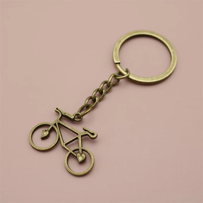 خمر سبيكة دراجة مفتاح سلسلة الرجال ريترو مجوهرات بسيطة الدراجة حلقة رئيسية حقيبة يد على ظهره قلادة