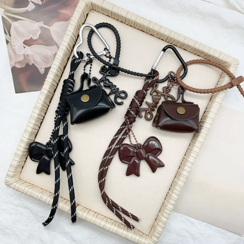 Hand-Woven PU leather key Ring With tassels And Heart-Shaped Pendant Brown Bowknot Beaded and Black and White Striped Design