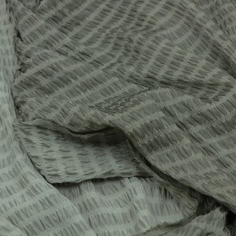 

Traditional dirt-dyed and stir-fried silk striped bubble crepe fabric a niche designer's new Chinese-style