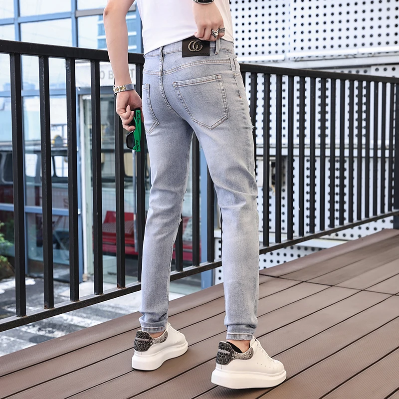 2024 spring and summer new hot drill hole men's jeans printed trend elastic Slim small leg pants high-end versatile men's pants