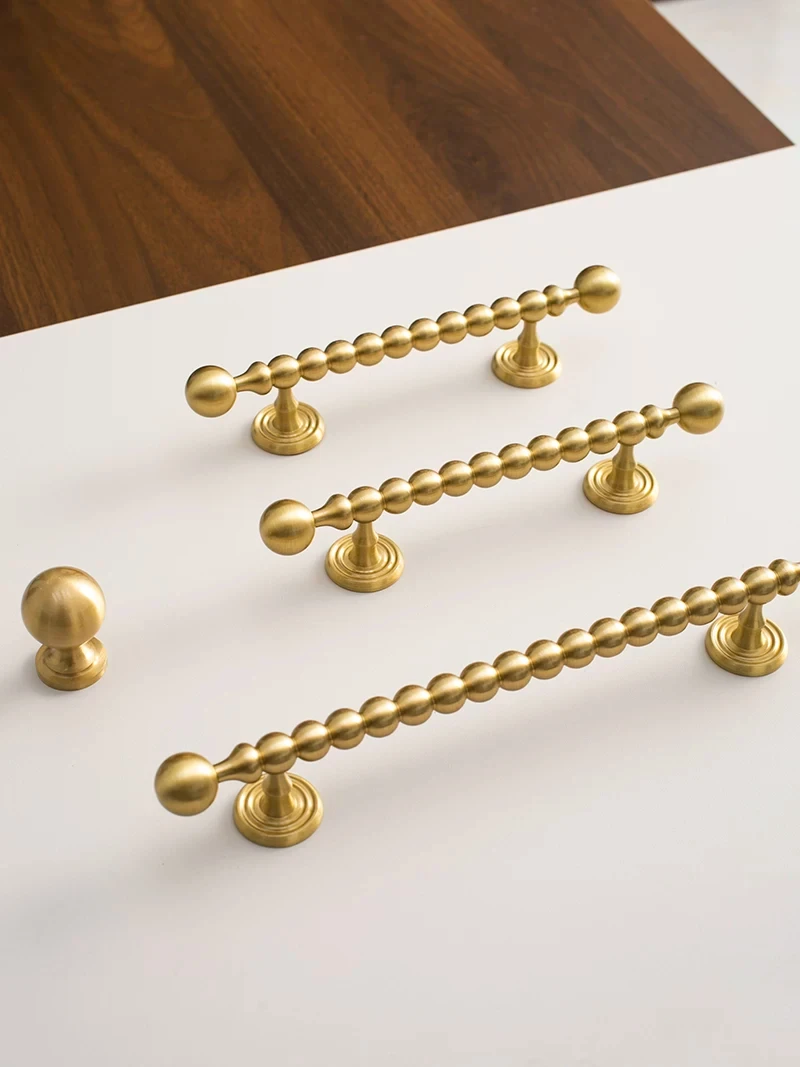 Beaded cabinet handle in brushed brass shown in the supplier product illustration 18