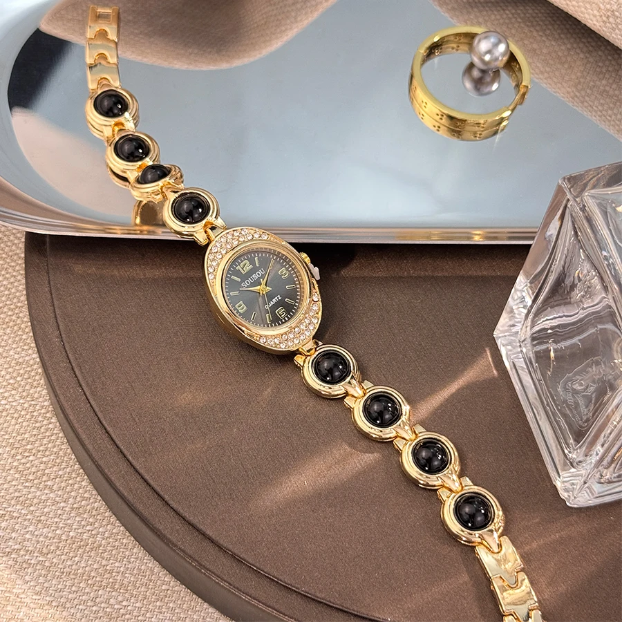 A new oval diamond-encrusted case with a shiny and colorful large bead bracelet unique and beautiful quartz watch for women