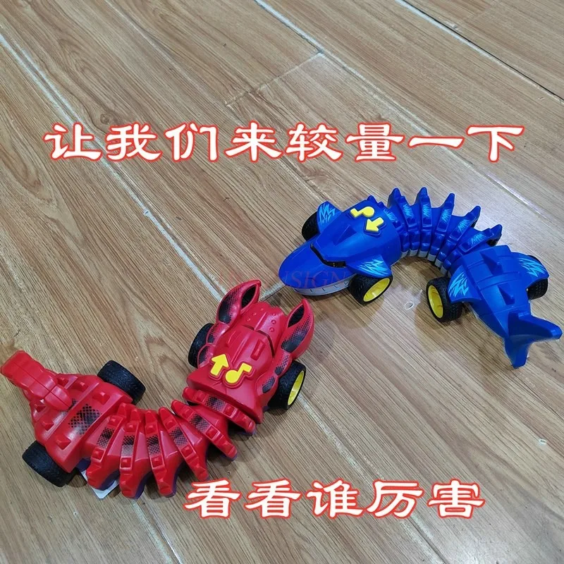 Elettrico meccanico Shark Fighting Bone Car musica per bambini Light Twisting Crawling Scorpion Crocodile Boy Puzzle Toy