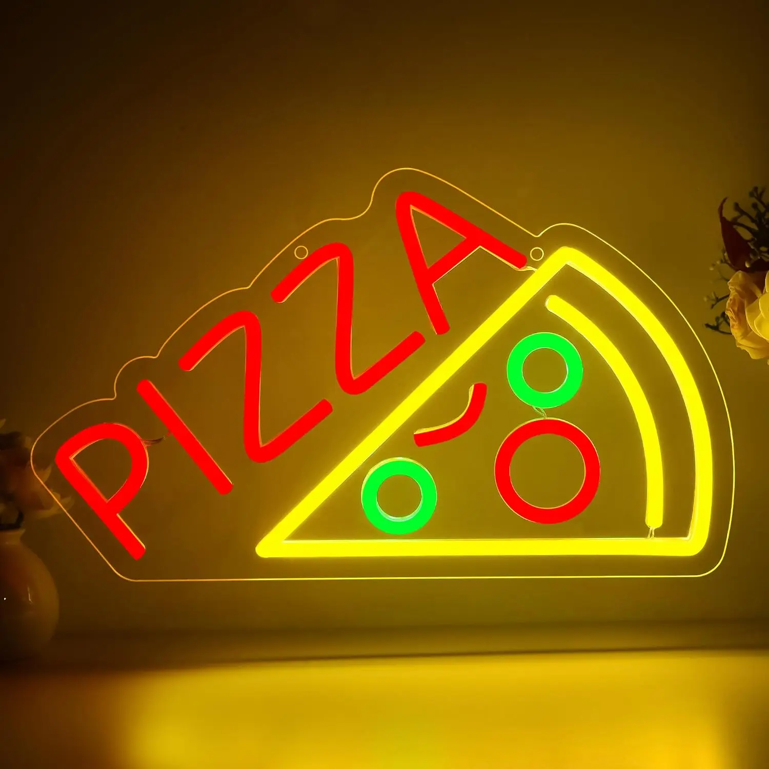 Vibrant pizza neon sign glowing in a dining area