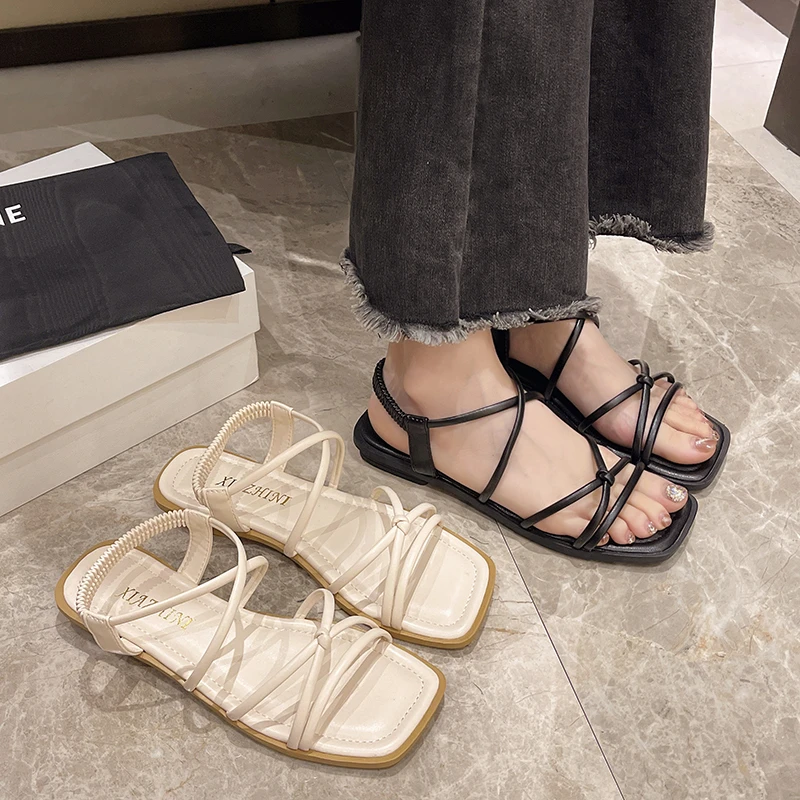 أحذية شاطئ صيفية جديدة ذات شريط رفيع على الطراز الخيالي للنساء متعددة الاستخدامات ونعل مسطح غير قابل للانزلاق ونعل متقاطع من كلمة واحدة شباشب رائعة بنعل ناعم #1