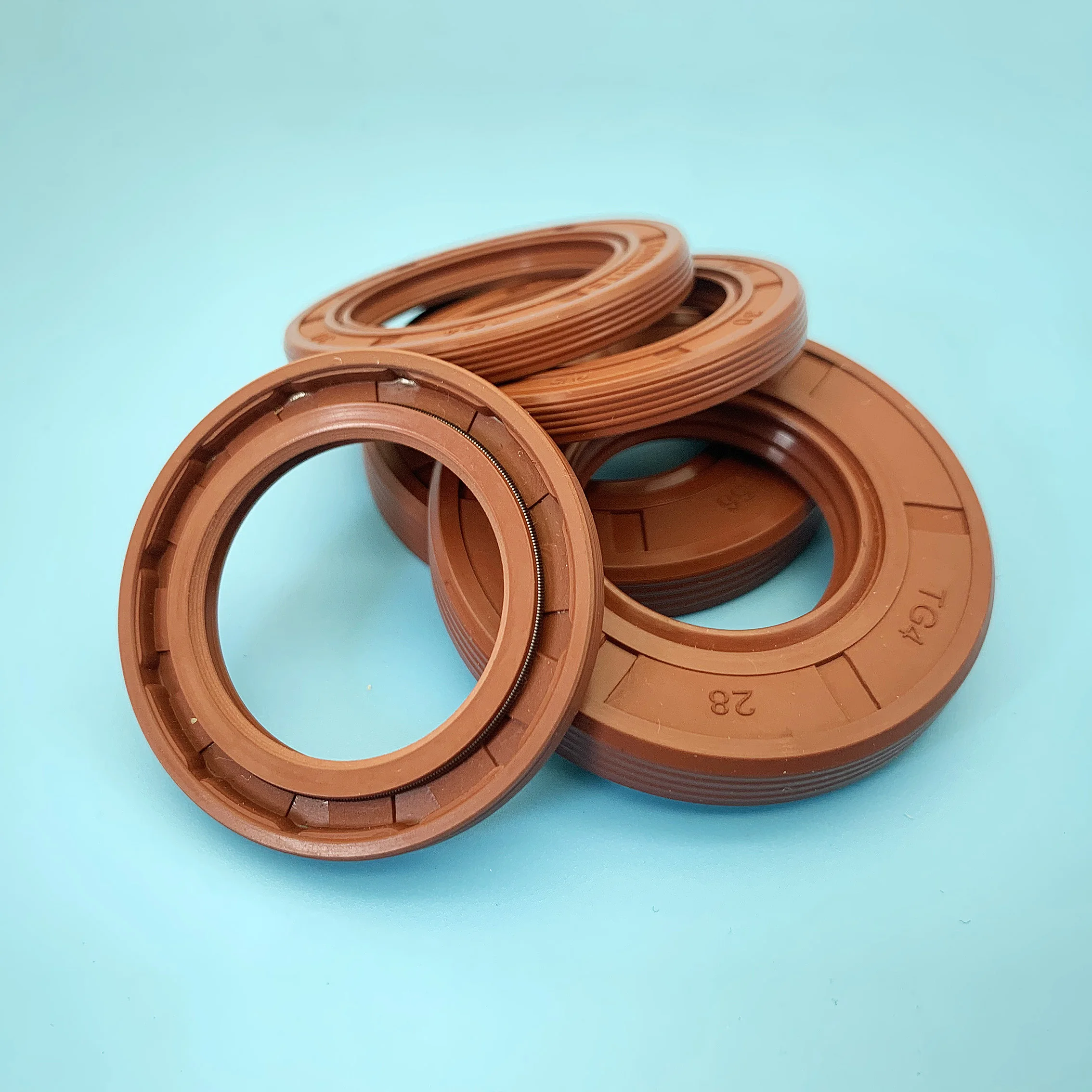 Seal ring berbahan fluororubber TG4, rangka/selempang oli, diameter dalam (ID) 25mm, diameter luar (OD) 32mm~62mm, bentuk bibir, seal berputar, tahan penuaan dan tahan ozon, berbahan FKM