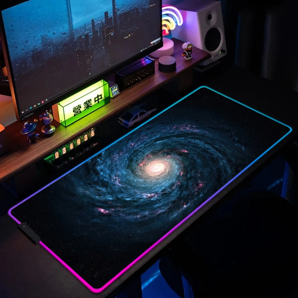 Gaming setup with full RGB desk mat lighting on