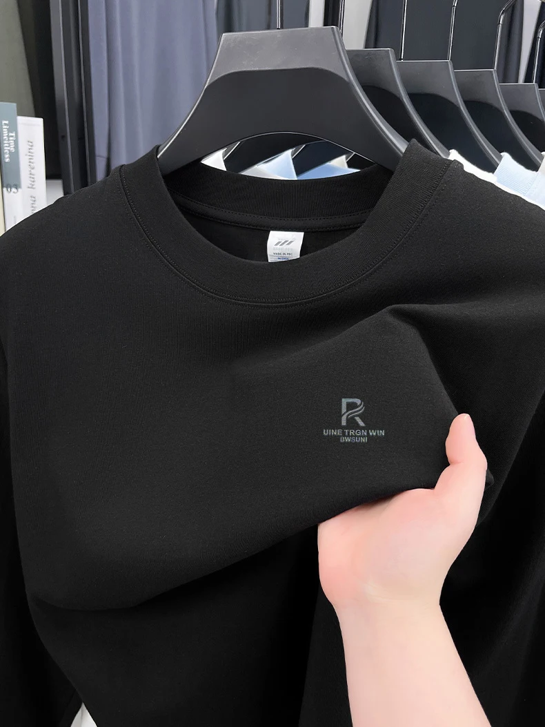 T-shirt a maniche lunghe da uomo in puro cotone di fascia alta 2025 Nuova primavera e autunno inverno girocollo allentato con cappuccio tinta unita da uomo